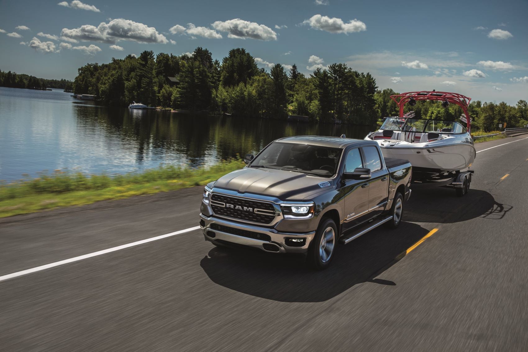2022 Ram 1500 Towing a Boat by the Lake